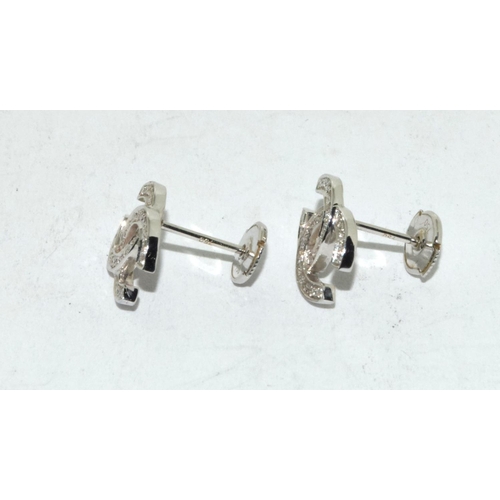 502 - 18ct white gold Chanel style earrings.