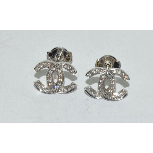 502 - 18ct white gold Chanel style earrings.