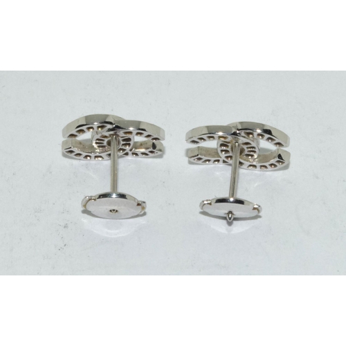 502 - 18ct white gold Chanel style earrings.