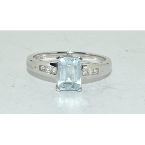 461 - Aquamarine Emerald cut ring set in 9ct white gold with diamond shoulders . Size N