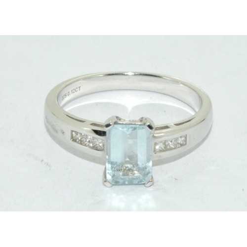 461 - Aquamarine Emerald cut ring set in 9ct white gold with diamond shoulders . Size N