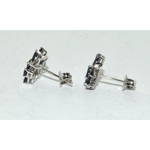 527 - Diamond & sapphire flower stud earrings set in 9ct white gold.