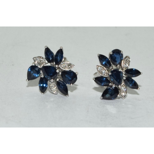 527 - Diamond & sapphire flower stud earrings set in 9ct white gold.