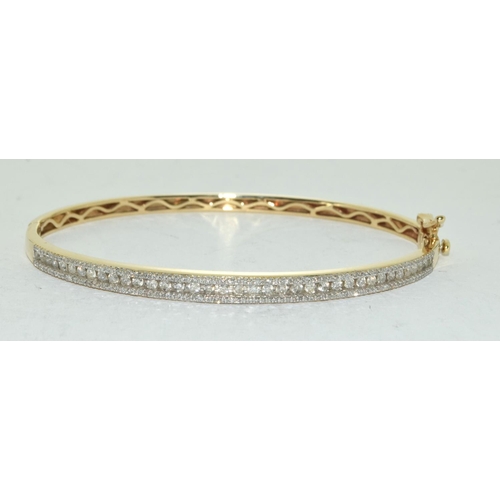 415 - 9ct Gold bangle set with 1ct diamonds.