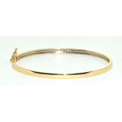 415 - 9ct Gold bangle set with 1ct diamonds.