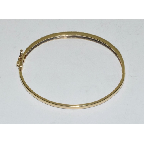 415 - 9ct Gold bangle set with 1ct diamonds.