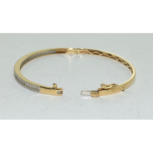 415 - 9ct Gold bangle set with 1ct diamonds.