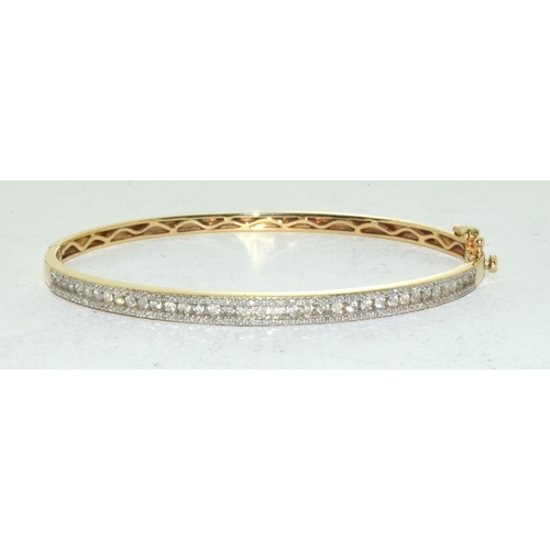 415 - 9ct Gold bangle set with 1ct diamonds.