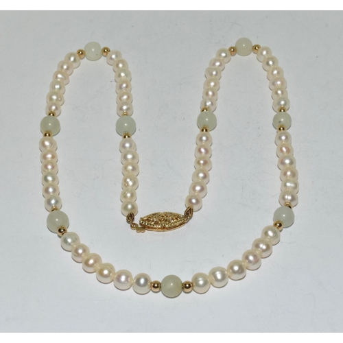 540 - Pearl and moonstone necklace with 14ct clasp.