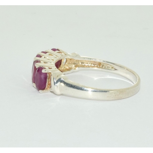 524 - A ruby five stone silver ring Size U