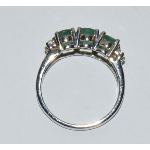 493 - A three stone possibly emerald silver ring Size U