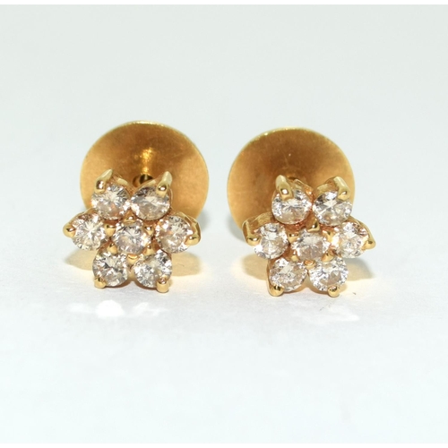 414 - Diamond Daisy earrings set in 18ct gold mounts.