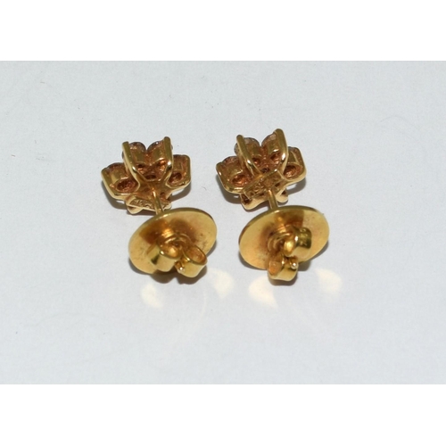 414 - Diamond Daisy earrings set in 18ct gold mounts.