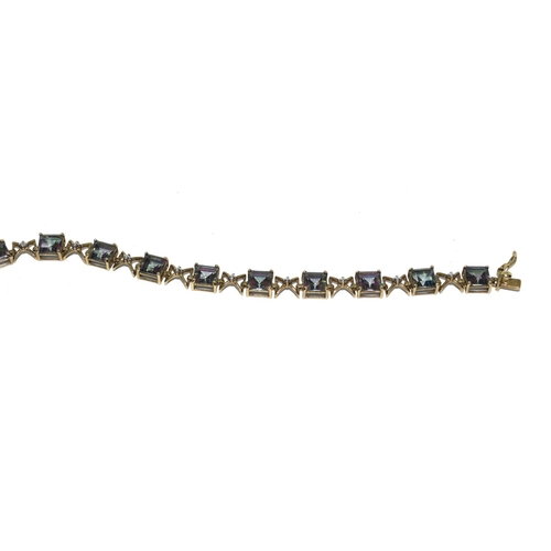 514 - 9ct gold ladies Mystic Topaz line bracelet 21cm long