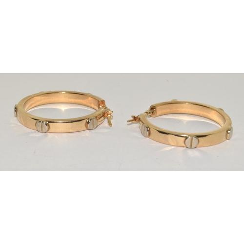 439 - 9ct gold ladies round hoop earrings in the Cartier love style 30mm