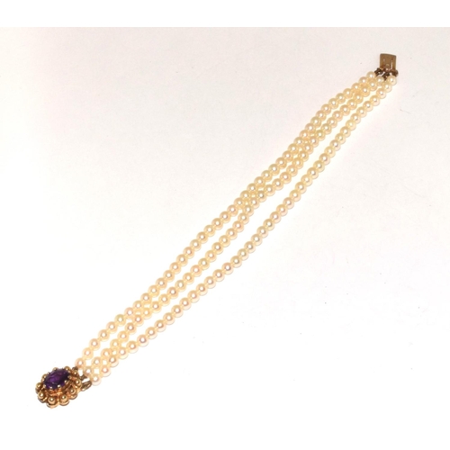 459 - 3 string  Vintage Pearl bracelet set with 9ct gold clasp with a central Amethyst stone