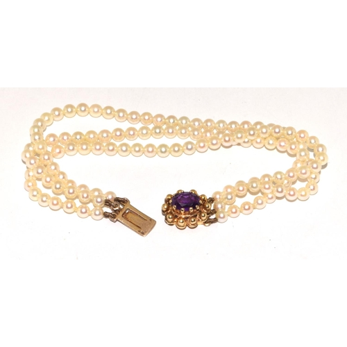 459 - 3 string  Vintage Pearl bracelet set with 9ct gold clasp with a central Amethyst stone