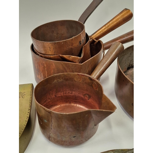 61 - Collection of antique copper and brassware to include saucepans and irons (9).