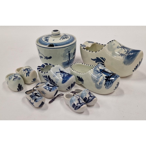 37 - Small collection of Delft blue and white pottery items to include pairs of clogs.