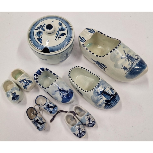 37 - Small collection of Delft blue and white pottery items to include pairs of clogs.