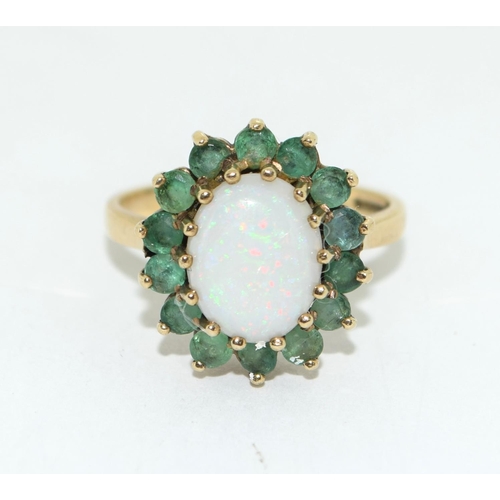 438 - 9ct gold ladies Emerald and opal cluster ring size M