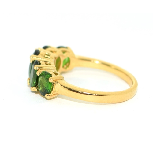 421 - A gold on 925 silver and five stone peridot ring, Size K