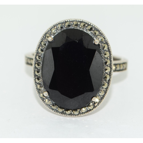 401 - An onyx and marcasite 925 silver cocktail ring Size S