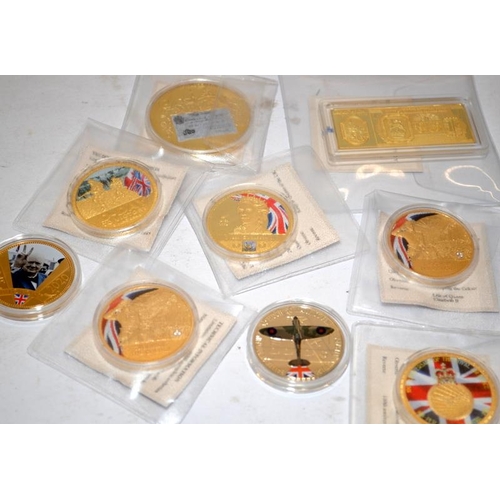 169 - Large collection of colour enhanced gold plated commemorative coins, mainly military and royal theme... 