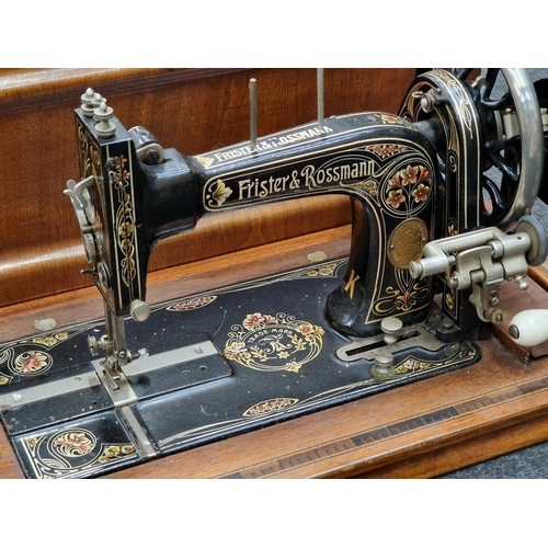 242 - Antique Frister & Rossmann sewing machine in wooden case.