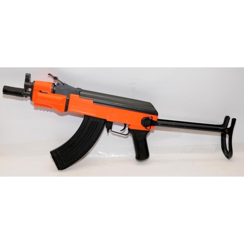 165 - BB gun in the style of an AK47 machine gun. Orange / black two tone body. Untested