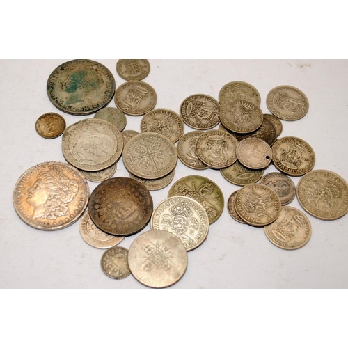 167 - A collection of silver coins to include an 1885 Morgan Dollar and a 1932 Netherlands 2 1/2 Gulden