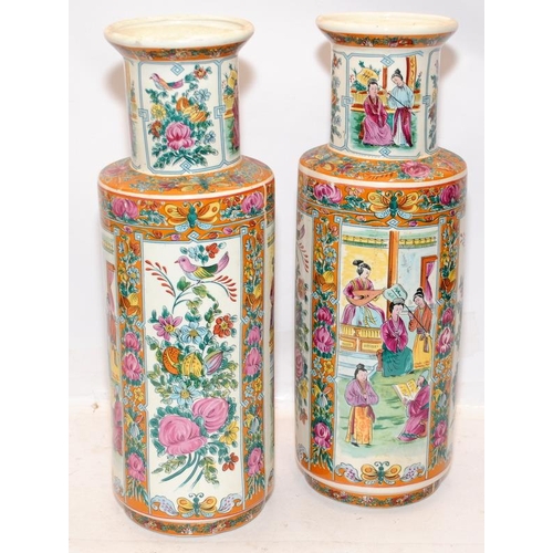 69 - Pair of decorative Oriental Mandarin Rose vases with hand painted panels. 42cms tall