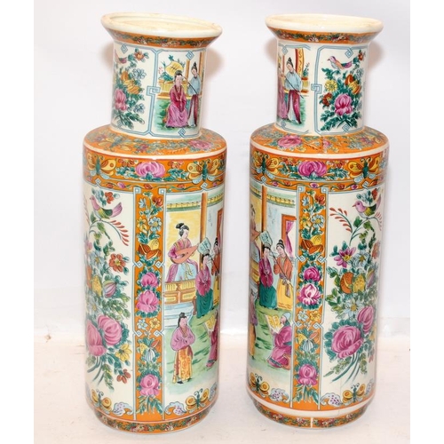 69 - Pair of decorative Oriental Mandarin Rose vases with hand painted panels. 42cms tall