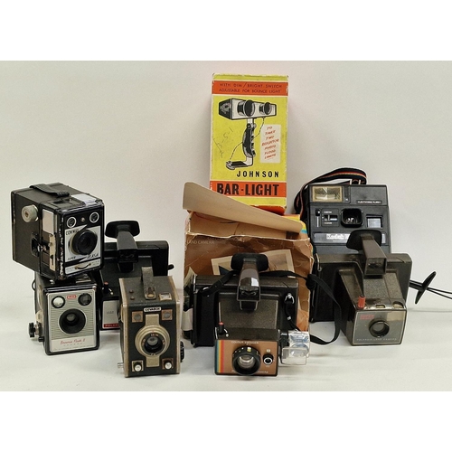 158 - Collection of vintage cameras and equipment to include Polaroid instant cameras.