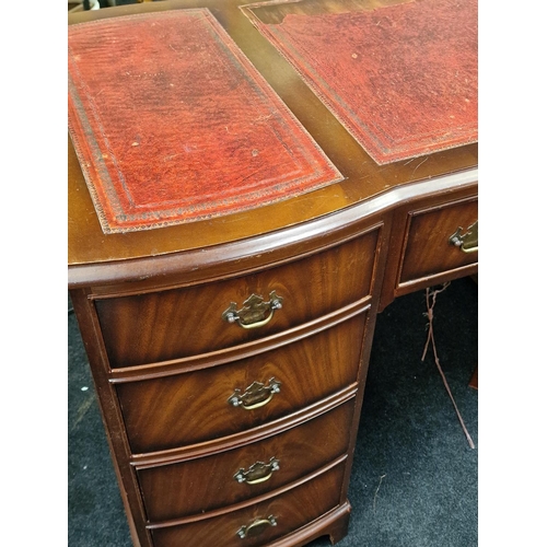 311 - Twin pedestal desk with tooled leather inset top above nine drawers 76x122x60cm.