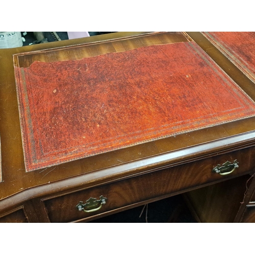 311 - Twin pedestal desk with tooled leather inset top above nine drawers 76x122x60cm.