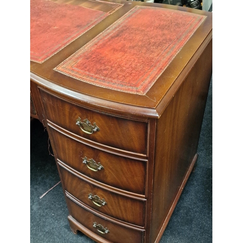 311 - Twin pedestal desk with tooled leather inset top above nine drawers 76x122x60cm.