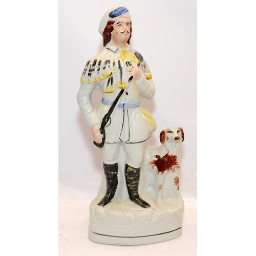 49 - Large antique Staffordshire flatback figure - Huntsman and hound. 34cms tall