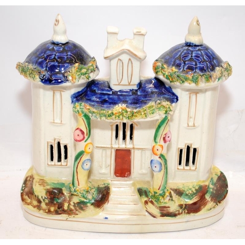 67 - Antique Staffordshire flatback buildings to include castle spill vase and money box. Largest is 18cm... 