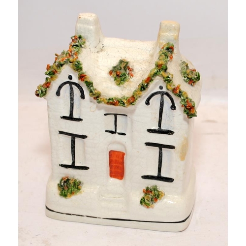 67 - Antique Staffordshire flatback buildings to include castle spill vase and money box. Largest is 18cm... 