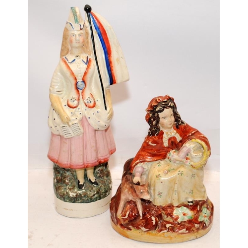 81 - Two antique Staffordshire flatback figures. Patriotic girl holding flag and songbook and Little Red ... 