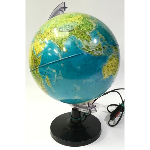 11 - An illuminated world globe of the world 82cm diameter 43cm tall.