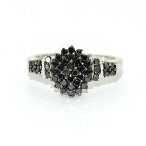 455 - Black diamond set in 9ct white gold ring Size L