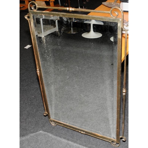 606 - Large bevelled edge mirror in a bronzed cast metal frame. O/all size 107cms x 74cms