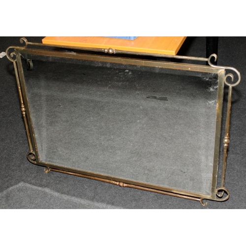 606 - Large bevelled edge mirror in a bronzed cast metal frame. O/all size 107cms x 74cms