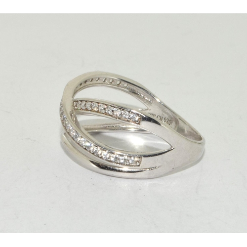 406 - A criss cross IBB CN 925 silver ring Size R 1/2.