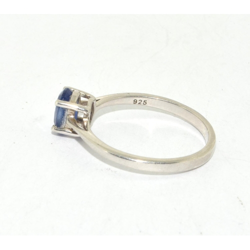 426 - A 925 silver TGGC ring with blue solitaire, Size O