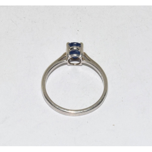 426 - A 925 silver TGGC ring with blue solitaire, Size O