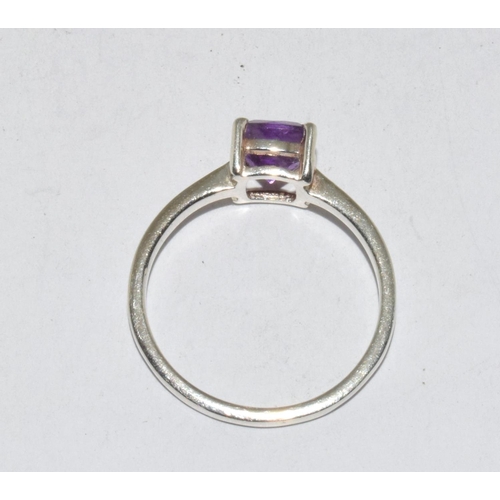 428 - A 925 silver and amethyst ring Size N.