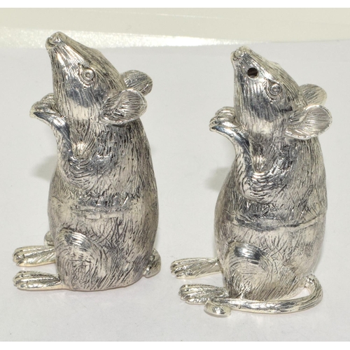 409 - A pair of silver plated mouse shaped condiments.